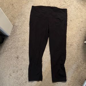 Lululemon, 12, black athletic capris, small hole in seam